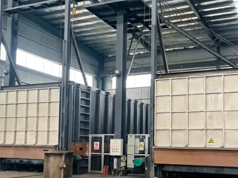 Large-scale programmable bogie hearth furnaces used for precise heat treatment and microstructural stability of heavy-duty rolling mill rolls.