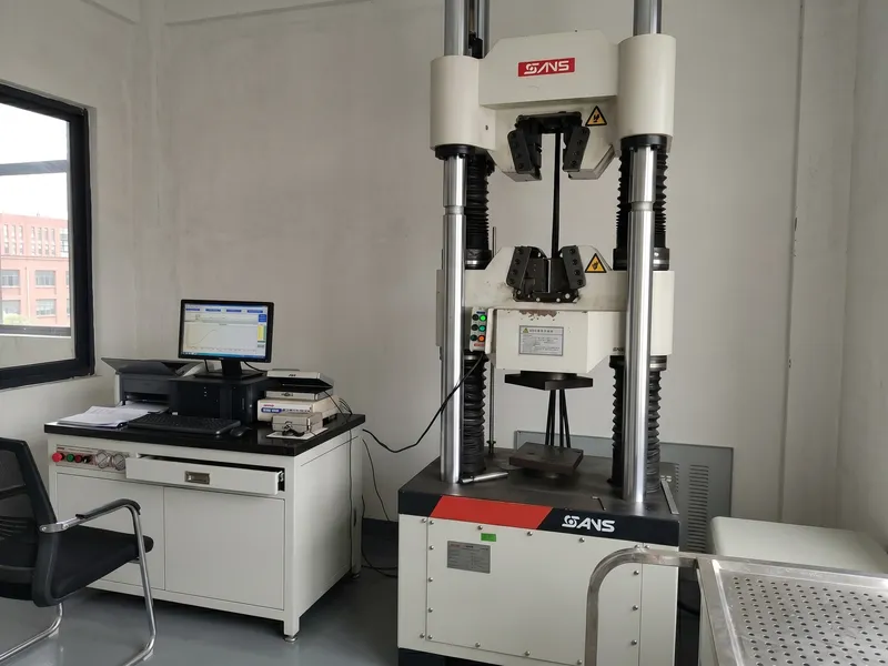 SANS universal testing machine used to verify the tensile and yield strength of cast mill roll test blocks.